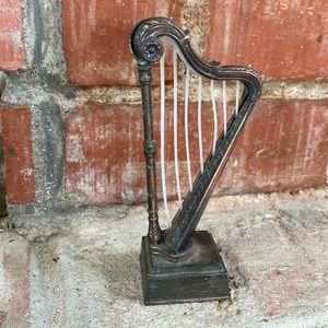 Die cast metal harp pencil sharpener